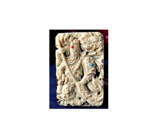 Amulet carved horn with natural horns