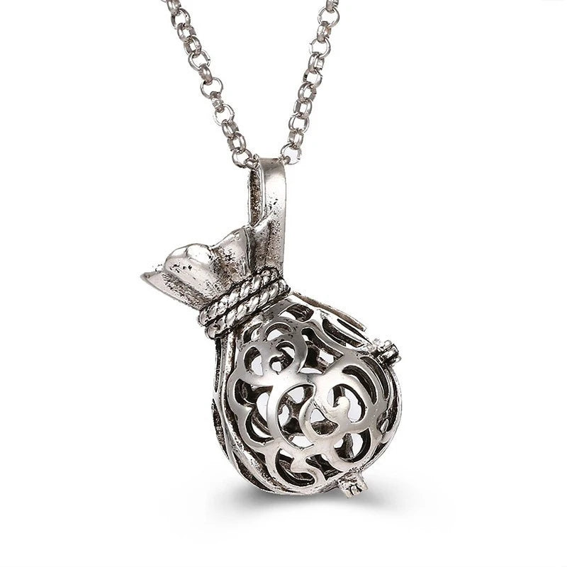 Nouveau charme carillon du mexique ailes d'ange creuses collier Vintage bijoux boule de musique pendentif aromatique pour les femmes accessoires de mode d'été