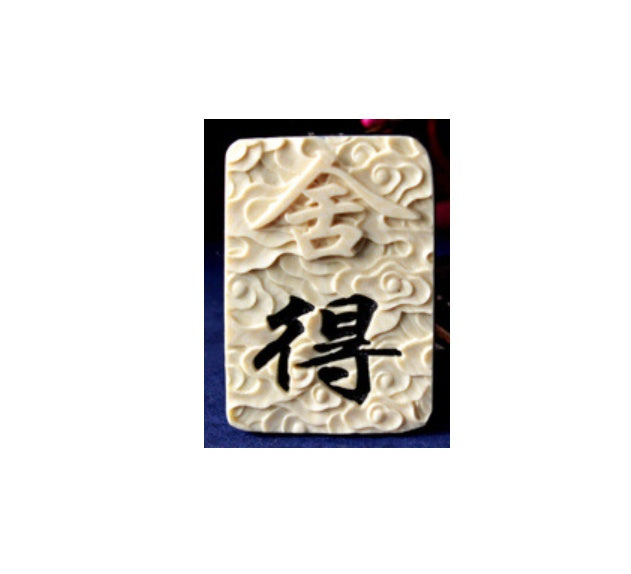 Amulet carved horn with natural horns