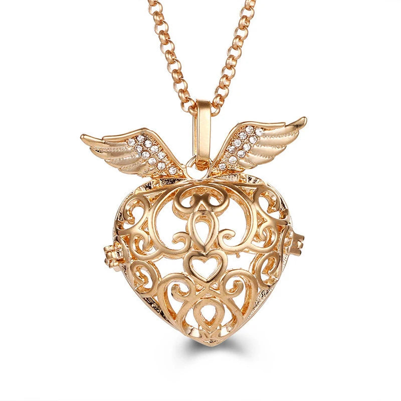 Nouveau charme carillon du mexique ailes d'ange creuses collier Vintage bijoux boule de musique pendentif aromatique pour les femmes accessoires de mode d'été